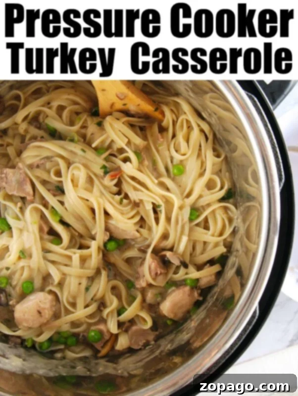 Instant Pot turkey tetrazzini is great using leftover turkey or rotisserie chicken! Cooked with tender noodles and vegetables all in one pot, you'll love it. #instantpotrecipes #turkeytetrazzini #leftoverturkeyrecipe #pressurecookerrecipes #instapot #instapotrecipes #instantpot Top view of turkey casserole with peas in an instant pot, text reads Instant Pot Turkey Tetrazzini.