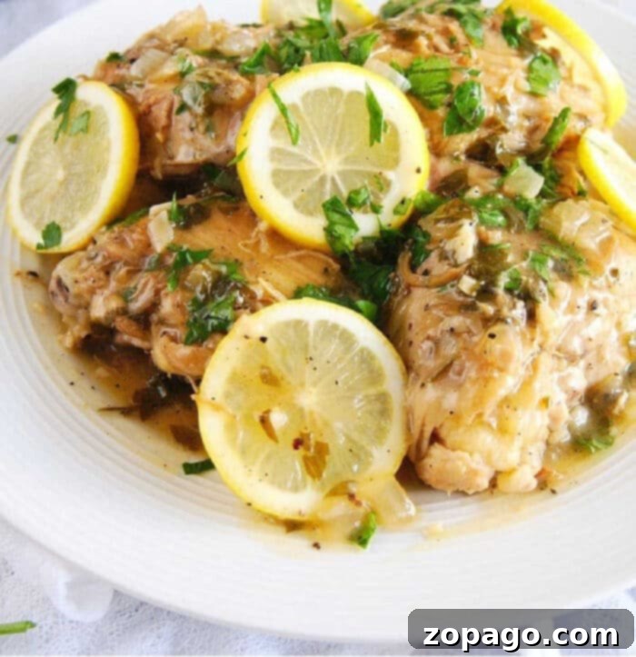 Zesty Instant Pot Lemon Chicken 7 Close-up of Instant Pot lemon garlic chicken, garnished with fresh herbs