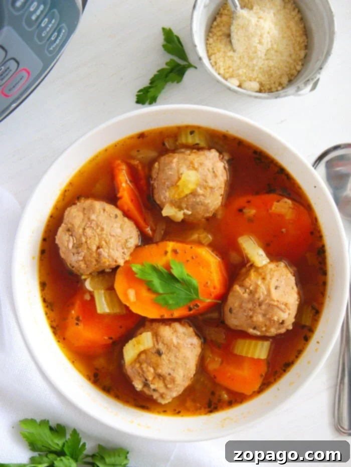 Delicious Low-carb Instant Pot Meatball Soup made with homemade or frozen meatballs in under 20 minutes flat! A healthy and keto friendly dinner you'll love. Hearty Instant Pot Meatball Soup with vegetables, perfect for a low-carb, keto dinner.