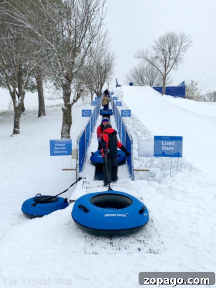 Boise Sledding: A Premier Winter Activity for Everyone at Gateway Parks View of the groomed snow tubing hill at Eagle Island in Boise, ready for winter fun.