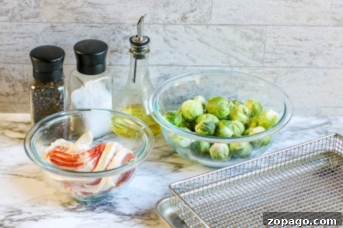 Crispy Air Fryer Bacon Brussels Sprouts 4 Platter of golden brown bacon and brussel sprouts, ready to serve as an appetizer.