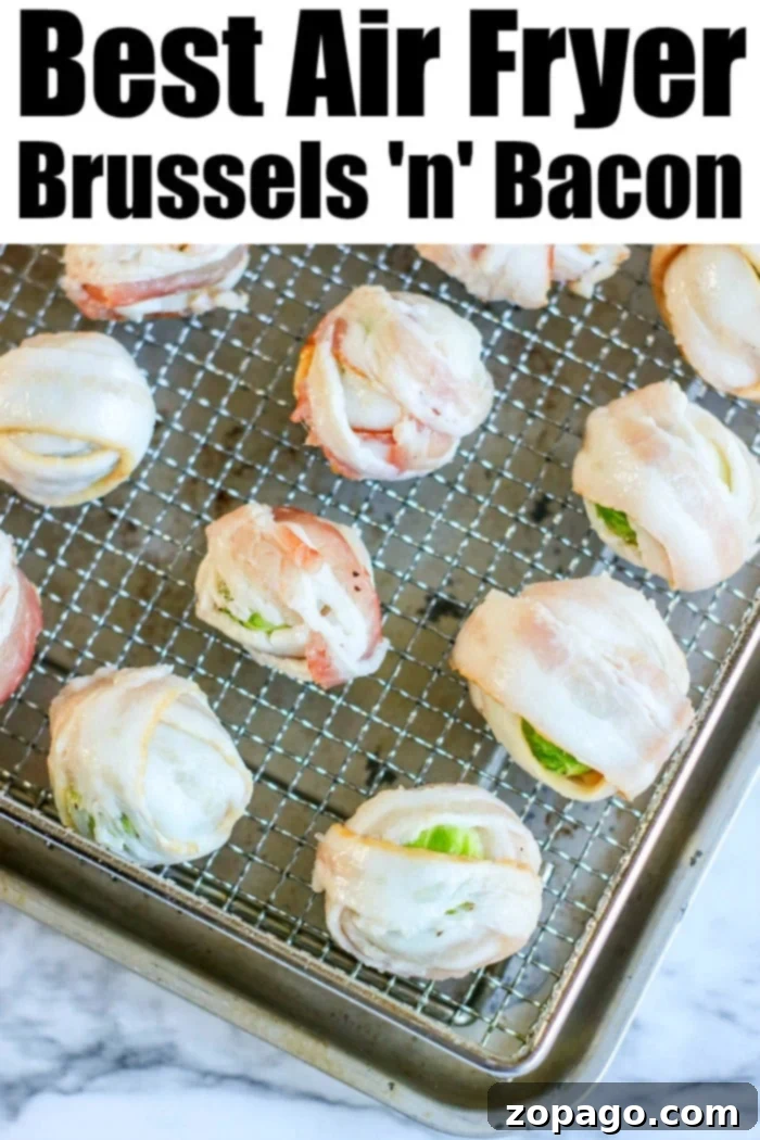 Brussel sprouts with bacon are the best air fryer appetizers! You can bake them in your oven too but get tender brussels with crisp bacon this way. #airfryerbrusselsprouts #brusselsprouts #bacon #brusselsproutsandbacon #airfryerrecipes #appetizer #ninjafoodirecipes A vibrant close-up of finished air fryer brussel sprouts, showcasing their golden brown bacon and tender green centers, ready to be enjoyed as a perfect appetizer or side.