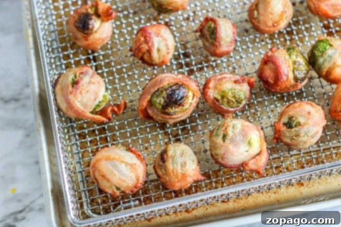 Crispy Air Fryer Bacon Brussels Sprouts 6 Close-up of crispy brussels sprouts with perfectly cooked bacon, glistening with a slight glaze.