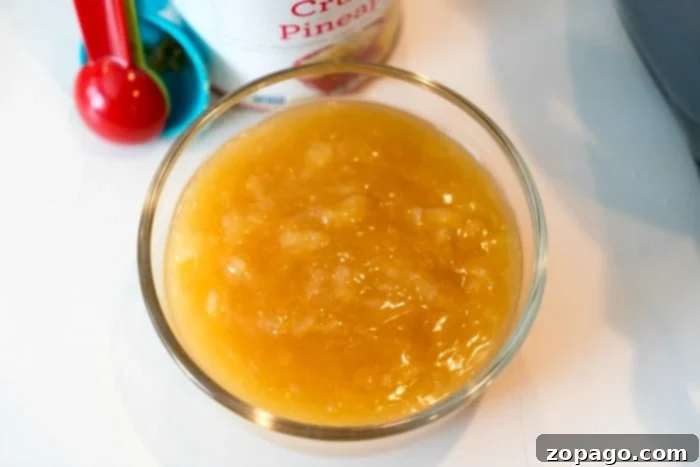 The Secret to a Perfect Pineapple Glaze A rich, golden pineapple glaze simmering, ready to be drizzled over a delicious ham.