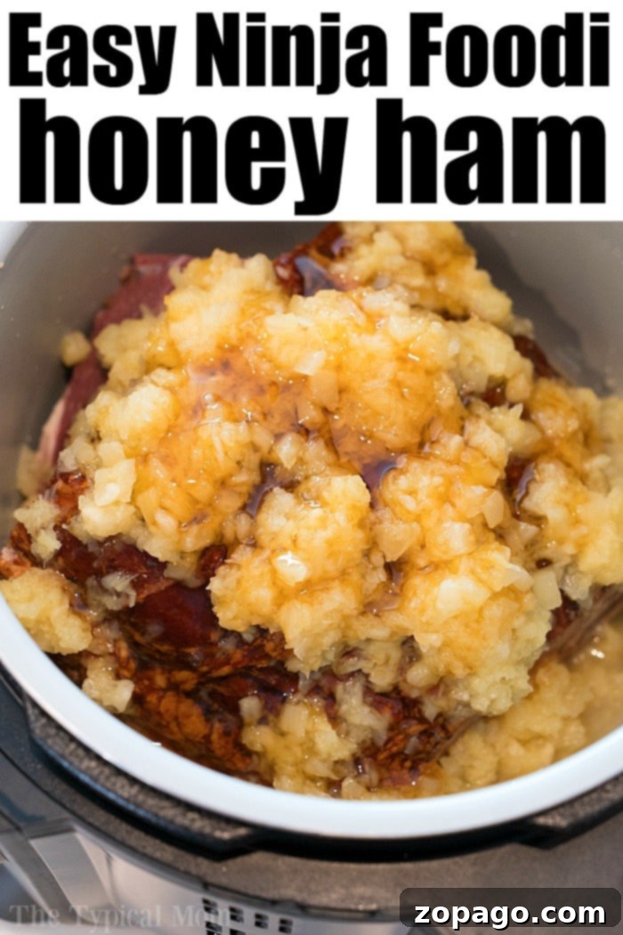 Ninja Foodi Honey Ham: A Holiday Delight A succulent Ninja Foodi ham with honey pineapple glaze, ready for serving.