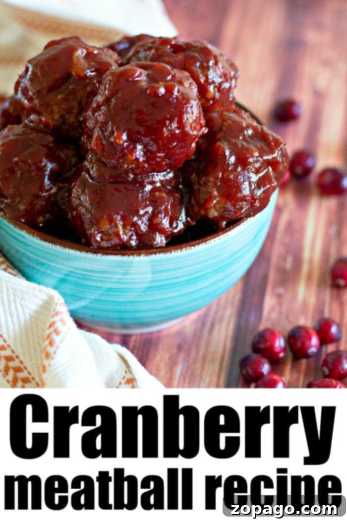 Homemade Cranberry BBQ Sauce Rich cranberry BBQ sauce simmering in a saucepan