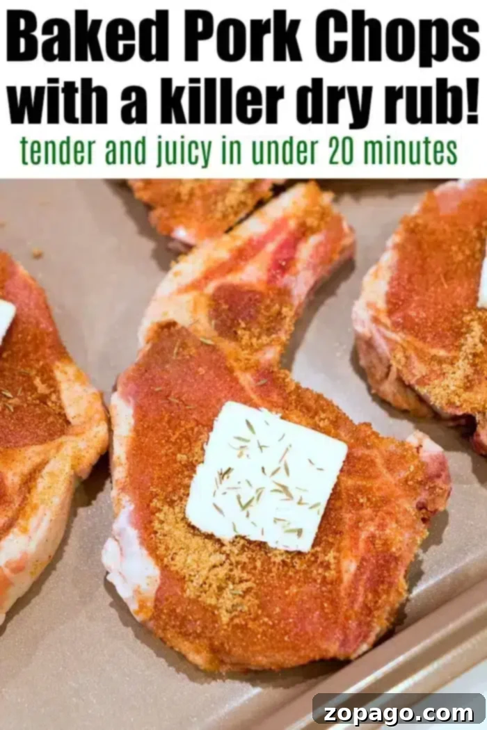 Flavorful Dry Rub Baked Pork Chops 12 Raw pork chops with a dry rub seasoning are on a baking sheet. Each chop has a pat of butter and herbs on top, showcasing the best baked pork chops. The text above reads: "Baked Pork Chops with a killer dry rub! Tender and juicy in under 20 minutes.