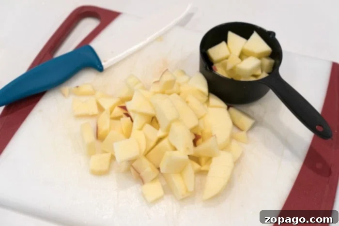 Golden Brown Sugar Apple Chunks 3 Ingredients for easy apple recipe laid out on a table, including peeled and diced apples.
