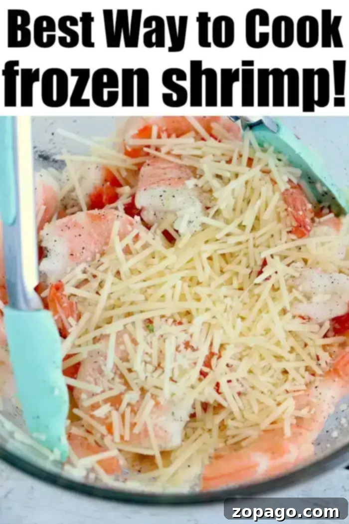 Crispy Air Fryer Frozen Shrimp 10 A bowl filled with jumbo frozen shrimp and grated parmesan cheese, positioned alongside blue tongs, all set for transformation into crispy air fryer shrimp.