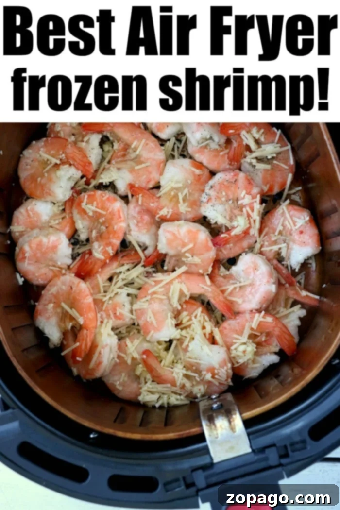 Crispy Air Fryer Frozen Shrimp 4 A top-down view of frozen shrimp generously coated with seasoning, arranged neatly in an air fryer basket, ready for cooking.