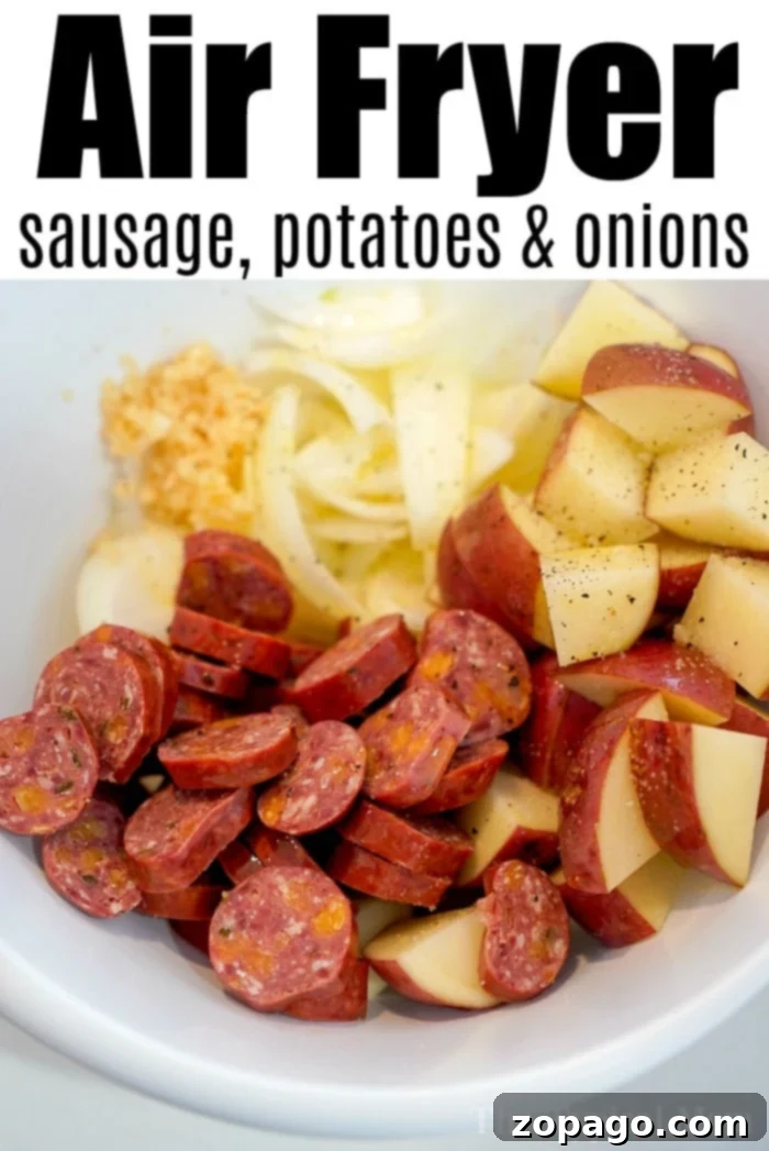 Sausage and potatoes in air fryer cooked together to perfection! Tender with a little crisp on the outsides makes this a hearty meal everyone will love. #airfryer #airfryerrecipes #ninjafoodi #foodi #ninja #ninjafoodirecipes #sausage #sausageandpotatoes #airfryerpotatoes Air fryer sausage and potatoes cooked to perfection