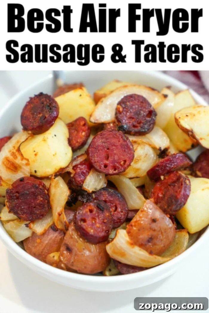 Air fryer sausage and potatoes cooked together to perfection! Tender with a little crisp on the outsides makes this a hearty meal everyone will love. A serving of air fryer sausage and potatoes with a rich, golden-brown crust, garnished with fresh herbs.