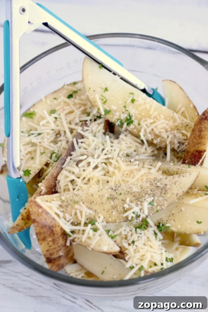How to make air fryer potato wedges. The best side dish or snack. Just slice and cook with some olive oil and parmesan for a mouth watering bite you'll love. potato wedges air fryer