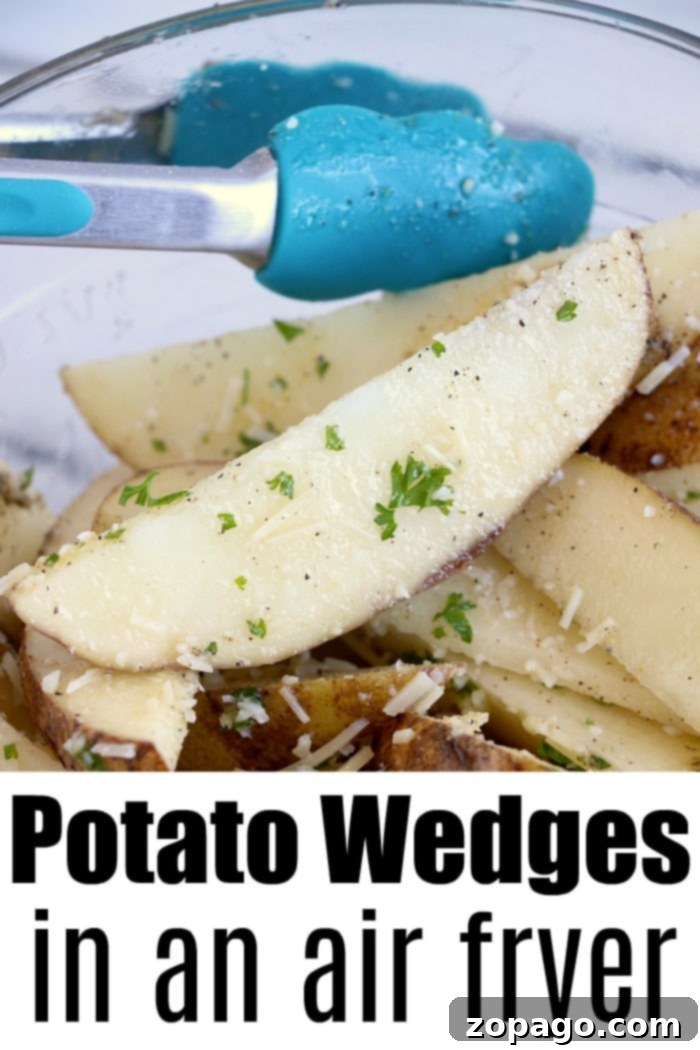 Close-up of perfectly seasoned air fryer potato wedges in a stylish white bowl, ready to be served with blue tongs. The image emphasizes the deliciousness of air fryer potato wedges as a snack or side.