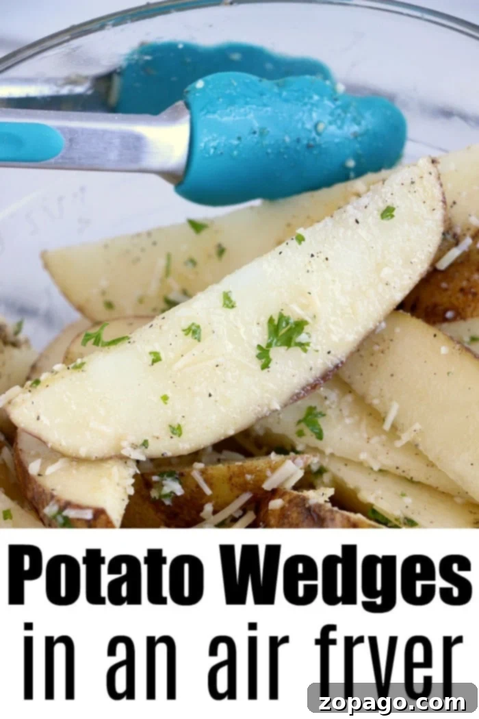Air fryer potato wedges are the best side dish or snack. Just slice and cook with some olive oil and parmesan for a mouth watering bite you'll love. Close-up of seasoned air fryer potato wedges in a bowl with blue tongs. Text: Potato Wedges in an Air Fryer.