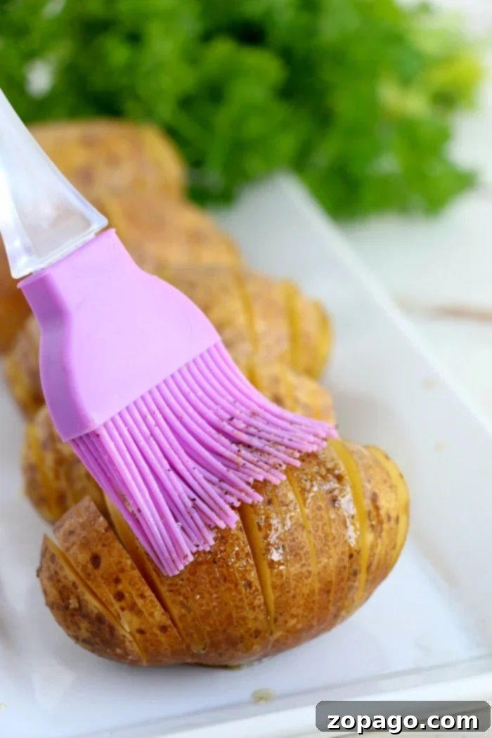 Crispy Air Fryer Hasselback Potatoes 4 Hasselback potato showing the unique accordion slicing technique before cooking.