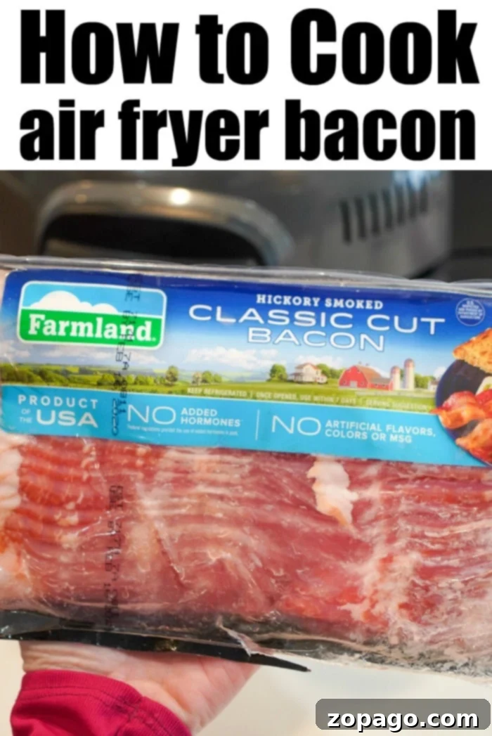 Air fryer bacon is a game changer! Grease drips away and it get crispy in no time at all for breakfast. Try Ninja Foodi bacon this morning and see. #airfryerbacon #bacon #airfryerrecipes #ninjafoodi #foodi #thetypicalmom Crispy air fryer bacon, cooked to perfection without excess grease.
