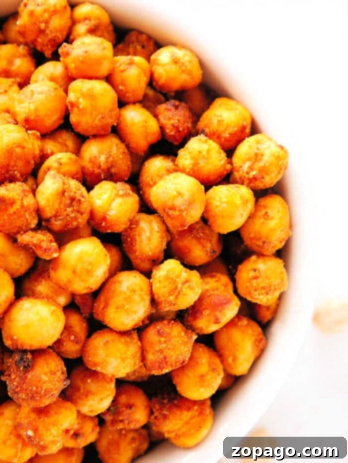 Crispy Air Fryer Chickpeas 2 Crispy air fryer chickpeas in a bowl, seasoned with taco seasoning and ready to eat as a high-protein snack.
