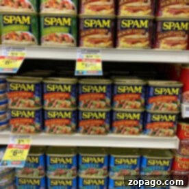 Crispy Air Fryer Spam 7 Cans of SPAM, perfect for your air fryer recipes, with various flavors and prices are displayed on grocery store shelves.