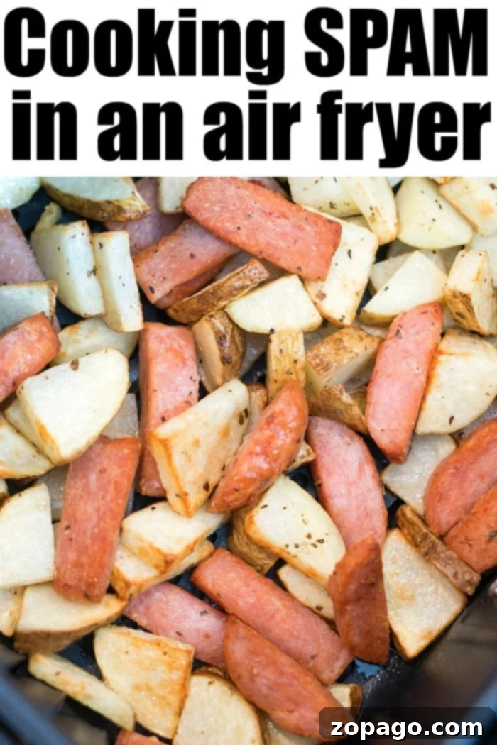 Air fryer SPAM is perfectly crispy, plus how to cook diced potatoes with it for a completely delicious meal in under 20 minutes flat! #spam #airfryer #spamrecipes #ninjafoodi #spamandpotatoes #airfryerspam #airfryerpotatoes Ninja Foodi SPAM with a perfectly crispy exterior, showcasing golden-brown edges.