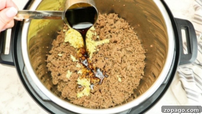 Tender Instant Pot Korean Beef 4 Korean ground beef with a delicious, glossy sauce, ready to be served.