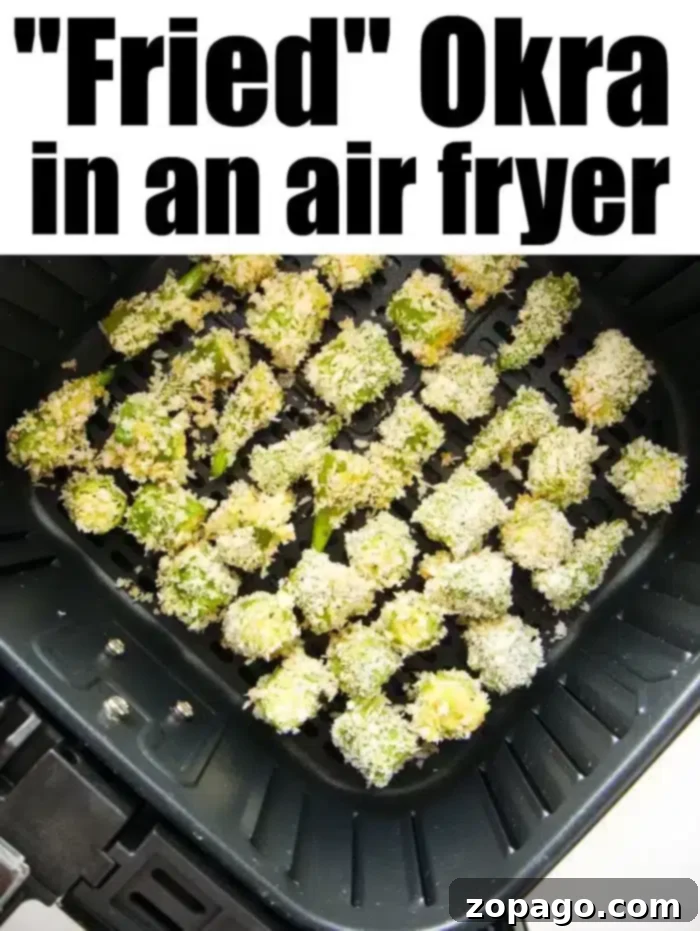Crispy Air fryer okra is so good! Crispy breadcrumbs coating on the outside with tender flavorful vegetable on the inside. Great side dish or low carb snack. Chopped okra perfectly coated in breadcrumbs sits inside the air fryer basket, showcasing how to create delicious fried okra without the mess.