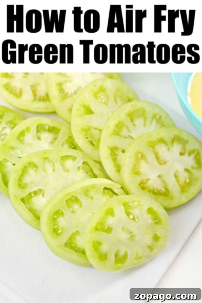 Close-up of freshly air-fried green tomatoes, showcasing their golden-brown, crispy coating.