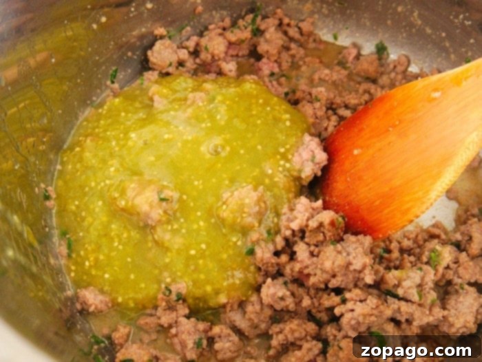 Quick Instant Pot Beef Taco Bowls 5 Salsa verde infused ground beef, perfect for taco bowls.