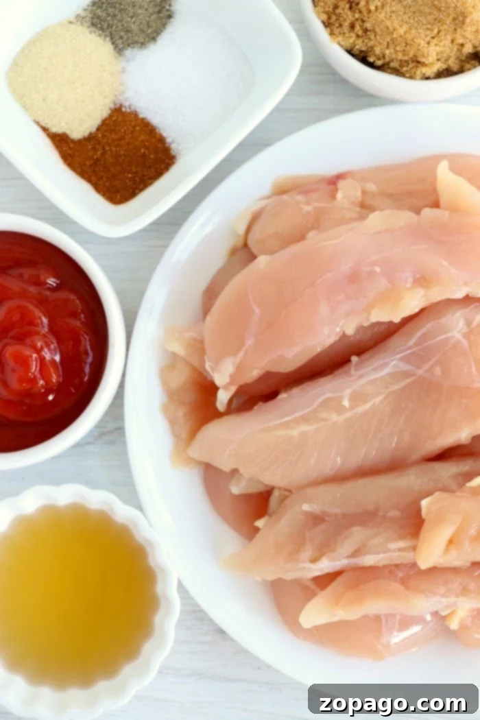 Healthy and tender air fryer chicken tenders no breading, marinated in delicious barbecue sauce. Marinated chicken tenders in a bowl, ready for the air fryer, promising a delicious no-breading meal.