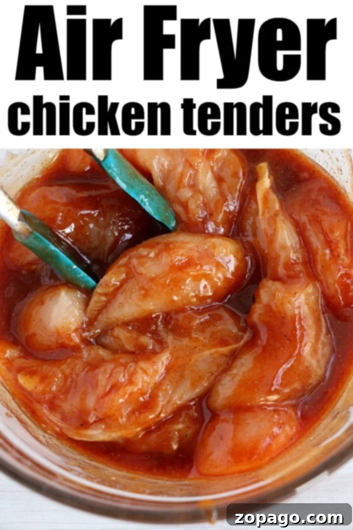 Marinated Air Fryer Chicken Tenders No Breading Raw chicken tenders marinated in a rich barbecue sauce, ready for air frying to create a healthy, no-breading meal.