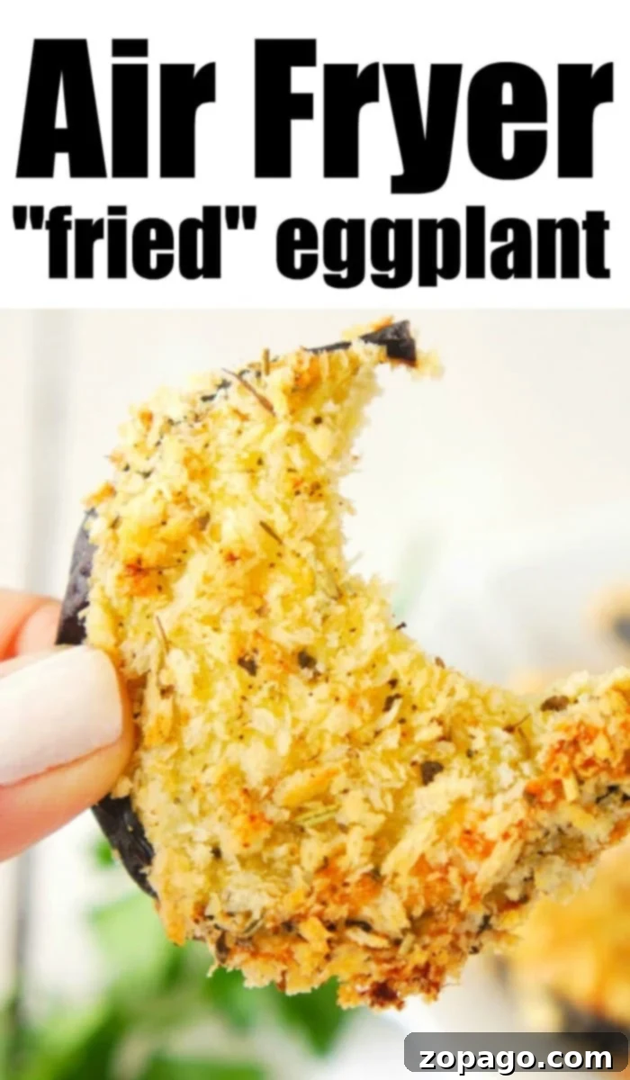 Crispy Air Fryer Eggplant 8 A large pile of crispy air fryer eggplant chips, garnished with fresh herbs, ready to be served.