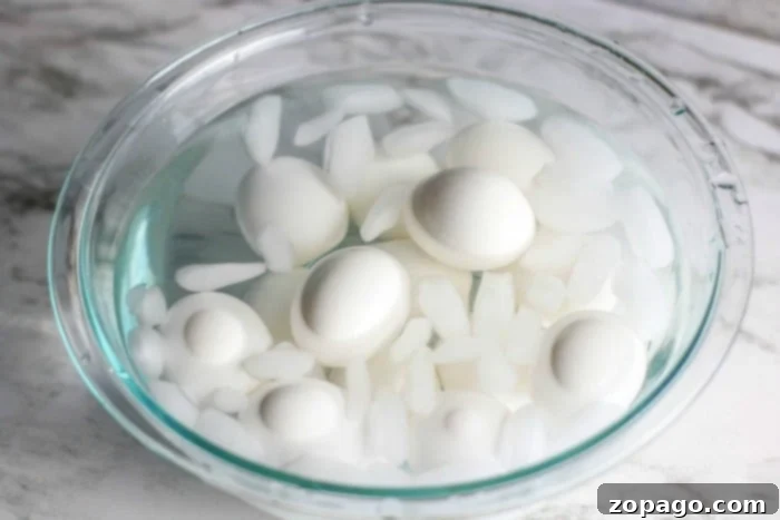 Skip the Pot: Oven Hard Boiled Eggs 4 A close-up of beautifully hard boiled eggs, showcasing their perfectly cooked whites and yolks.