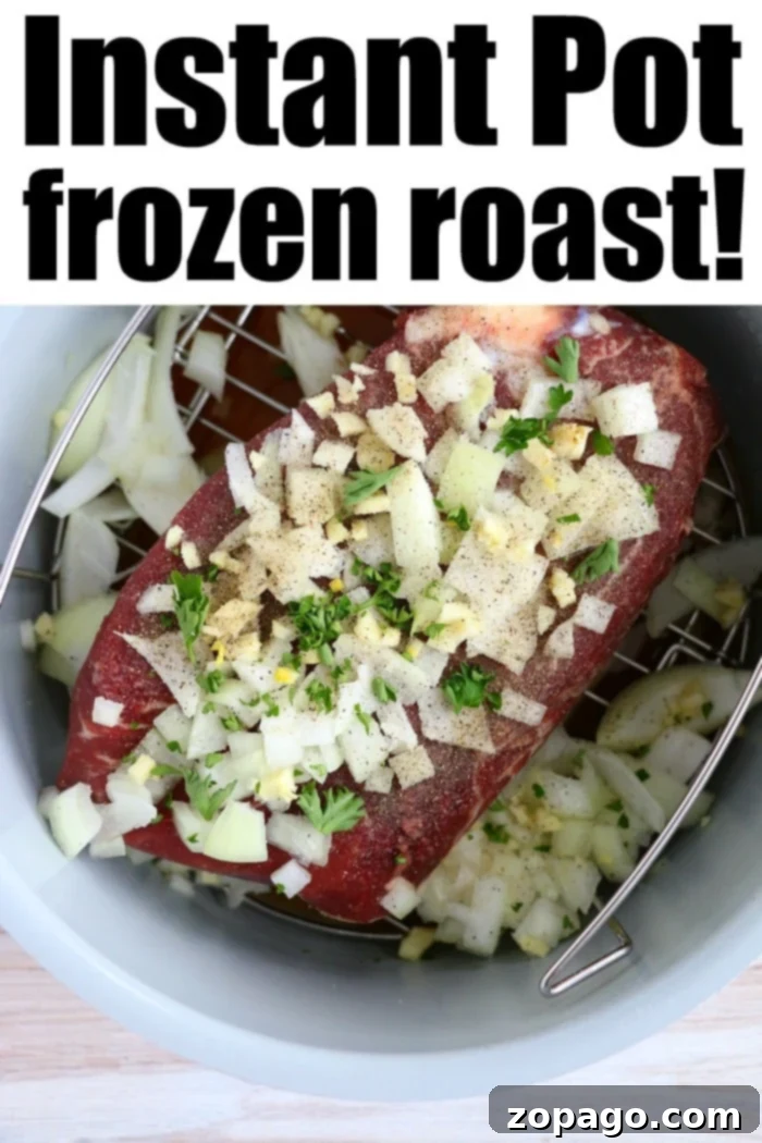 Frozen roast in Instant Pot is possible! You can still get a tender, flavorful, piece of beef even if it is not thawed out beforehand. Here's how! #instantpot #roast A raw frozen roast covered with chopped onions, garlic, and herbs sits inside an Instant Pot on a metal trivet. The caption reads "Frozen roast in Instant Pot magic!