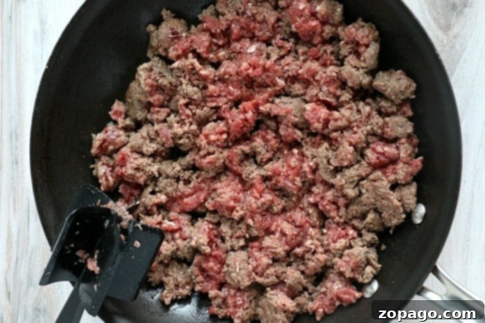 Hearty Ground Beef and Potato Bake 5 Skillet with browned ground beef and diced onions