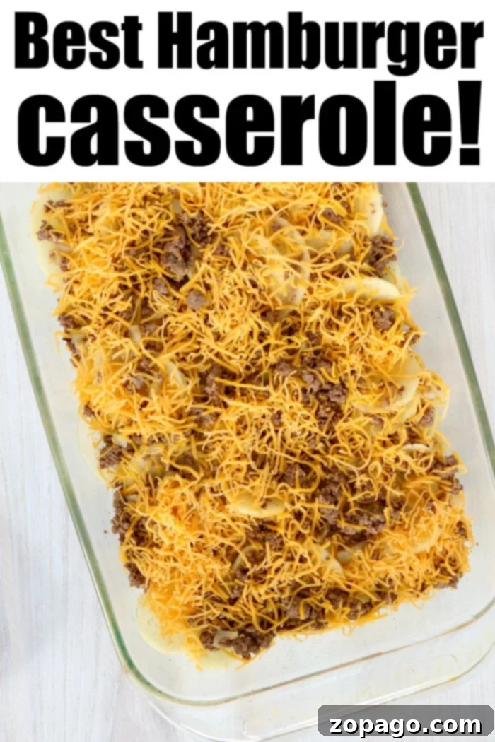 Hamburger casserole with potatoes is perfect for breakfast or a potluck! Like cheeseburger scalloped potatoes, this will become a family fave. Close-up of a baked easy ground beef casserole with golden cheese