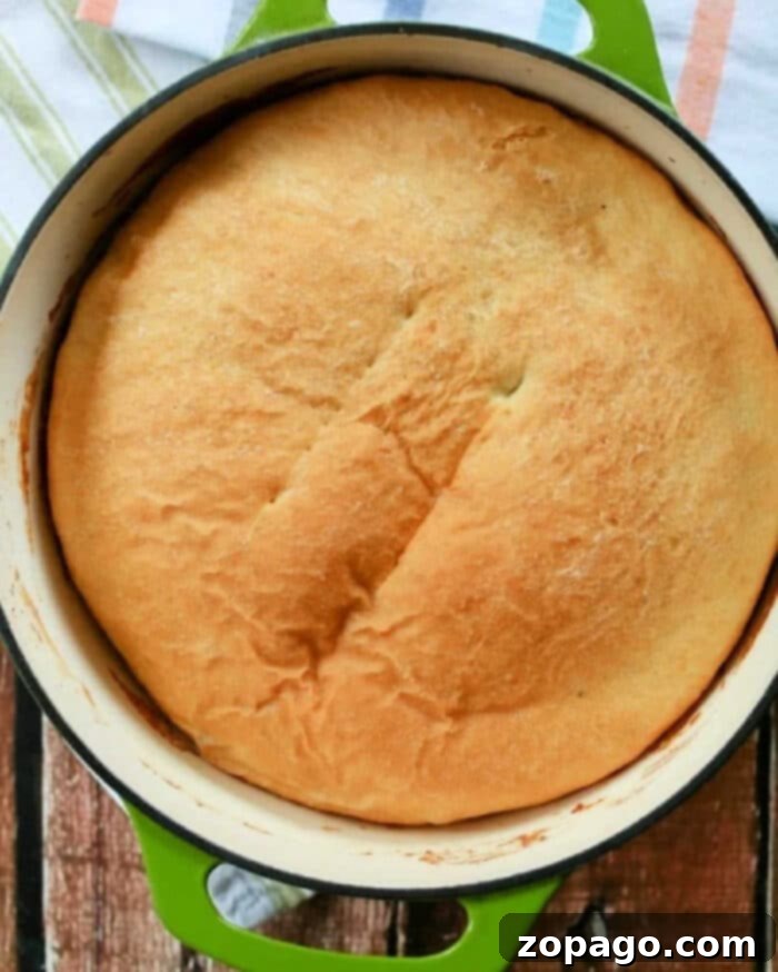 The Secret to Flawless Dutch Oven Bread 2 Freshly baked cast iron Dutch oven bread, golden brown and crusty