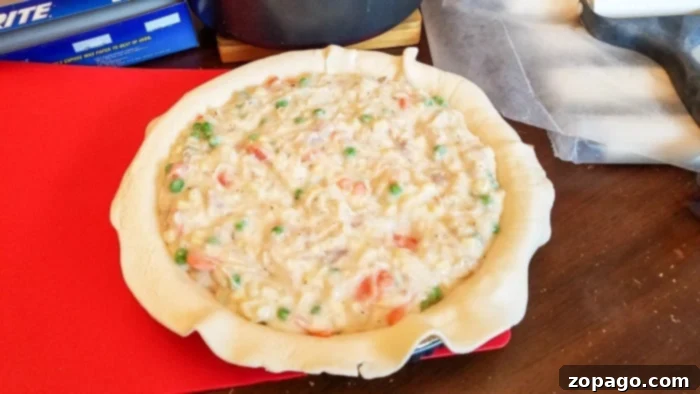 From-Scratch Leftover Turkey Pot Pie 7 The pot pie filling is spooned into the bottom crust, ready for the top layer.