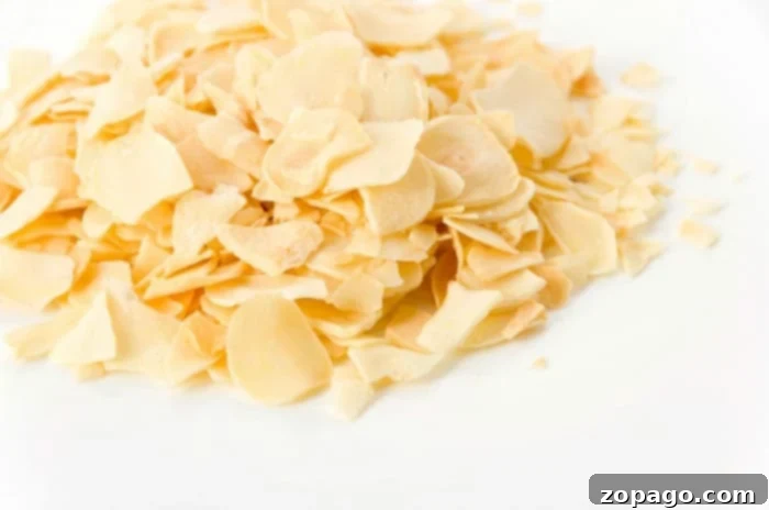 Mincing Garlic Cloves 7 Close up of dried garlic flakes, a useful substitute when fresh garlic isn't available, illustrating another form of garlic.