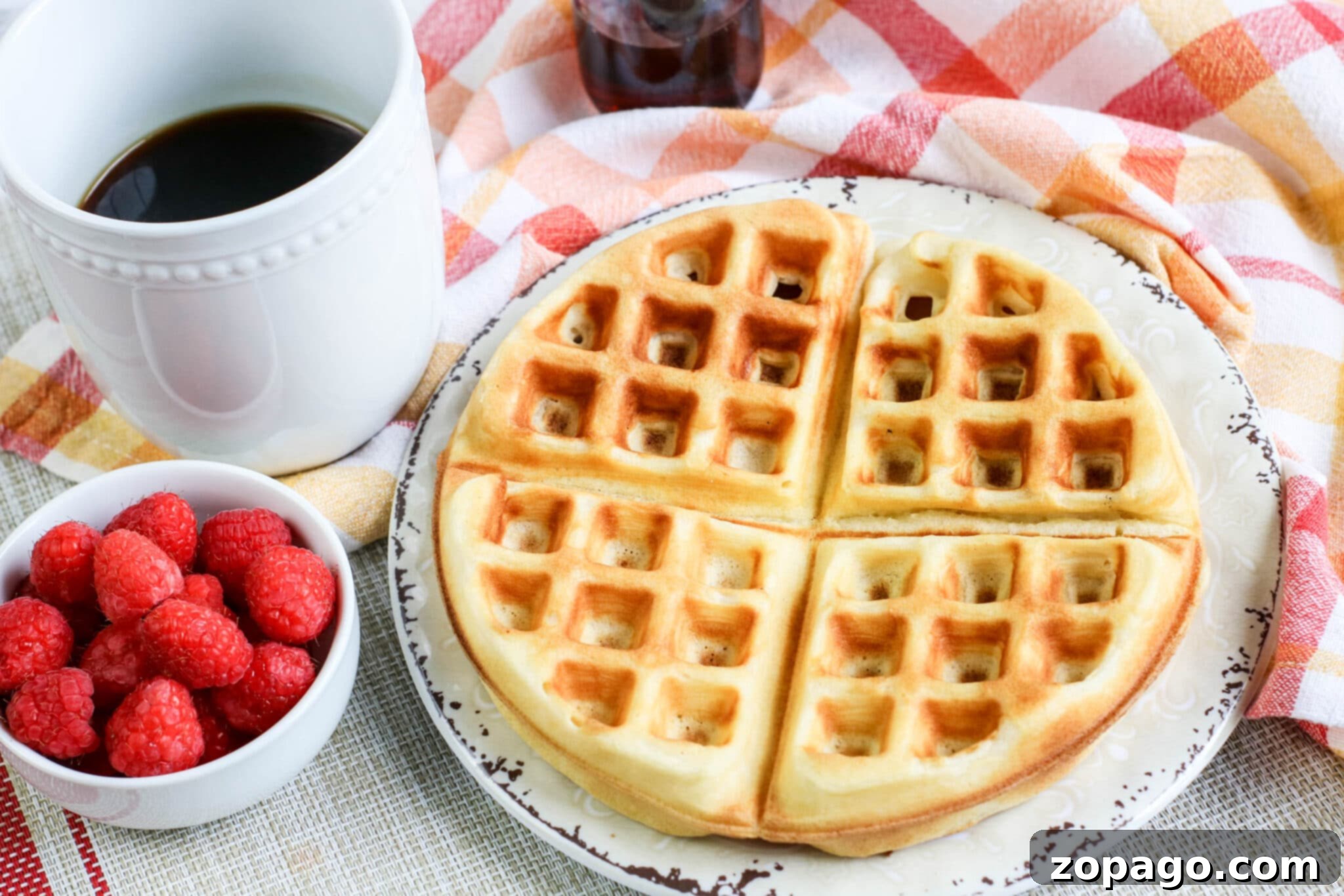 Whip Up Perfect Homemade Waffles 7 A beautifully presented stack of homemade waffles, topped with fresh berries and syrup.