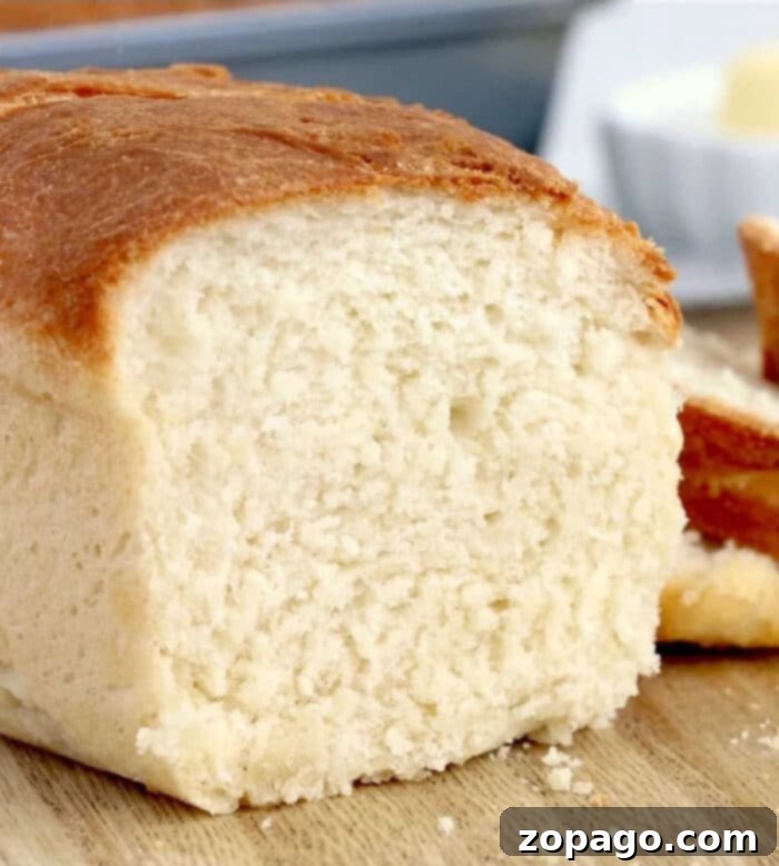 Air Fryer Bread Made Simple 6 Two golden-brown mini loaves of air fryer bread resting on a cooling rack after baking, showing their perfectly crusty exterior.