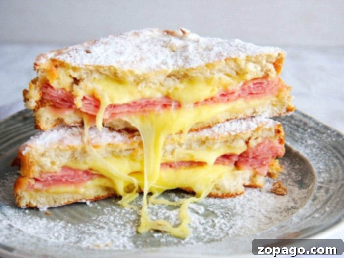 Crispy Air Fryer Monte Cristo 5 Monte Cristo sandwich cut in half, showing layers