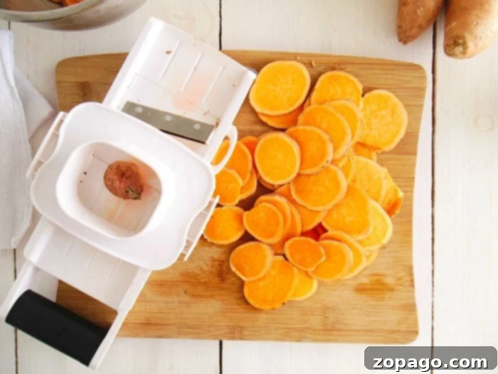 Crispy Air Fryer Sweet Potato Chips 4 Thinly sliced sweet potato chips, ready for the air fryer, promising a crispy snack.