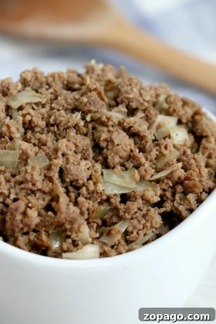 Flavorful Crockpot Ground Beef 5 Close-up of raw hamburger meat ready to be seasoned and cooked in a slow cooker