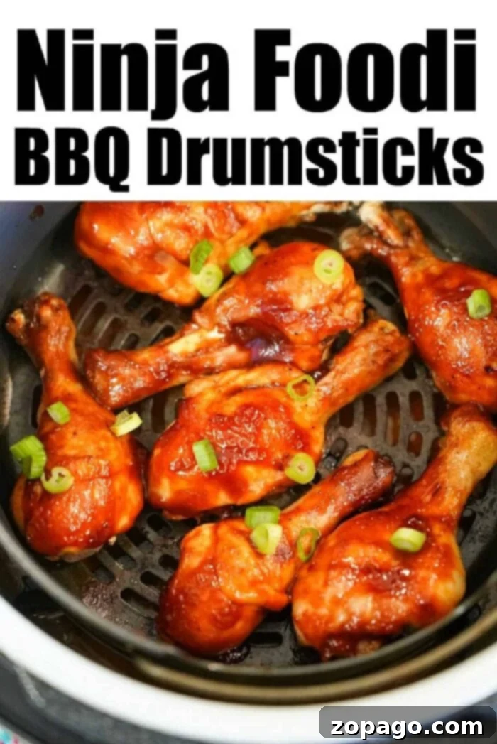 Ultimate Ninja Foodi Barbecue Drumsticks 11 Close-up of a Ninja Foodi chicken legs recipe, highlighting the crispy skin and delicious sauce.