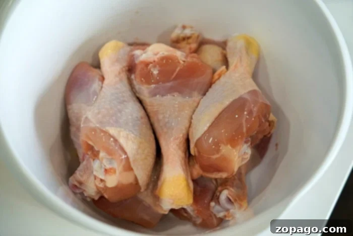 Ultimate Ninja Foodi Barbecue Drumsticks 5 Close-up of golden-brown chicken legs, glistening with barbecue sauce, after being cooked to perfection.