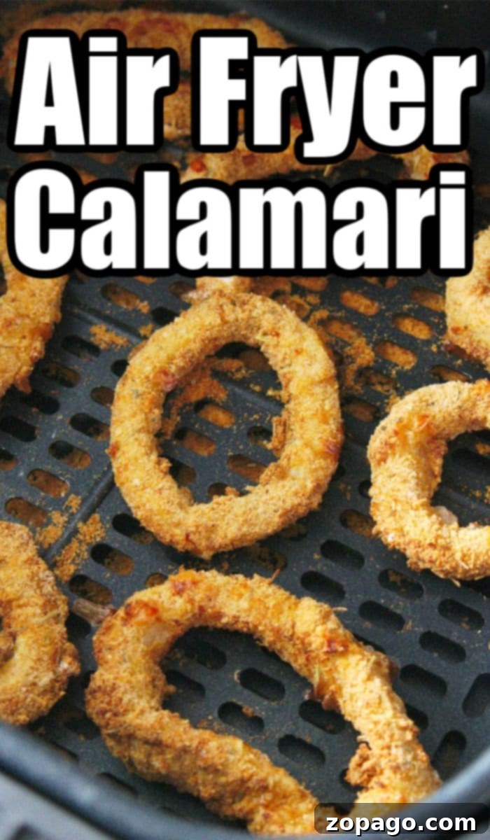 Close-up of golden, crispy air fryer calamari, ready to be enjoyed.