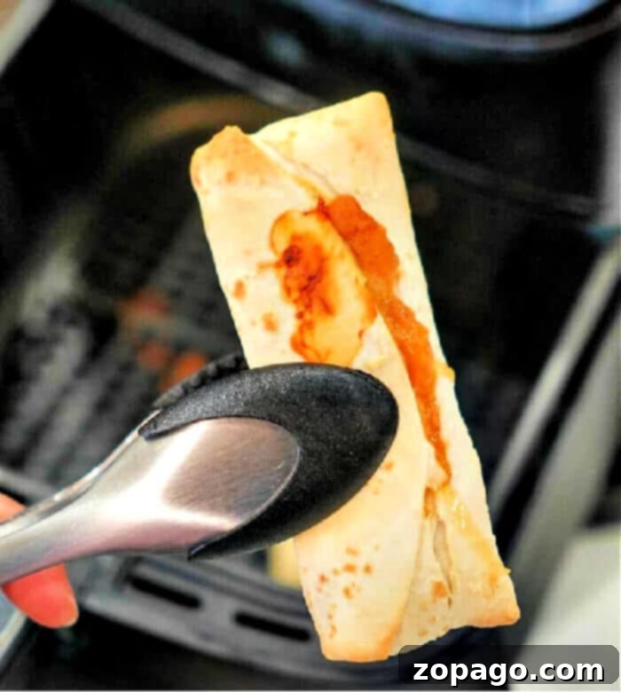 Crispy Air Fryer Frozen Burrito 2 Crispy frozen burrito cooked to perfection in an air fryer, golden brown and ready to eat