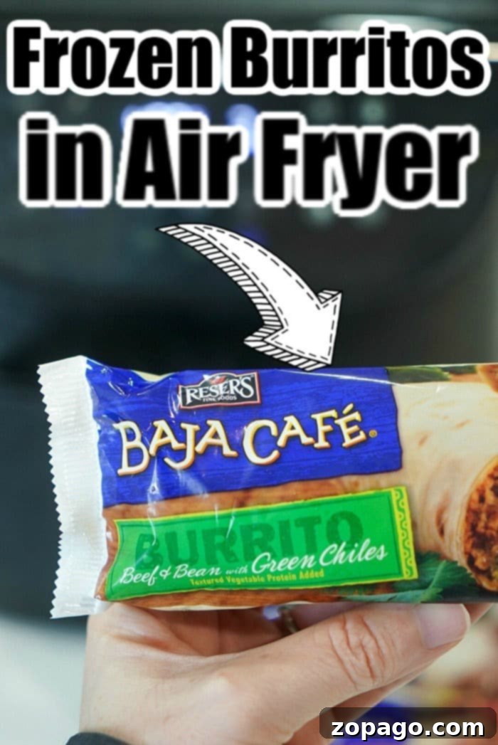 Crispy Air Fryer Frozen Burrito 3 Two frozen burritos in an air fryer basket, showing the crispy texture developing