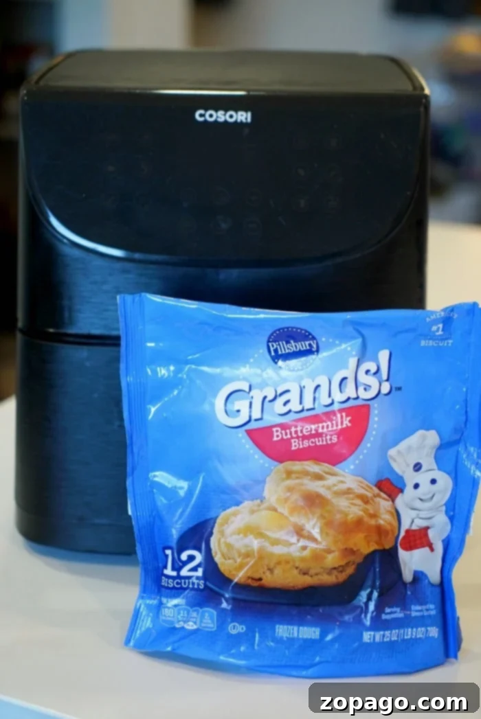 Air Fryer Frozen Biscuits: Golden Perfection 2 Frozen Biscuits in Air Fryer: Golden-brown and fluffy biscuits arranged neatly in an air fryer basket, ready to be served.