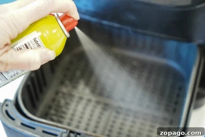 Air Fryer Frozen Biscuits: Golden Perfection 5 A close-up of a can of non-stick cooking spray, essential for preventing frozen biscuits from sticking in the air fryer basket.